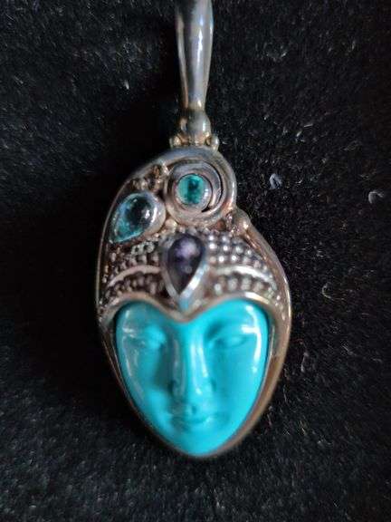 Pendant with a Carved Face image