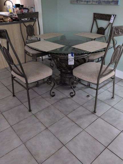54" Metal and Glass Table And 4 Chairs image