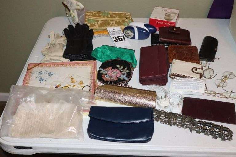 Variety of Items: Ladies Evening Bags, Gloves, Wallets, Defuzzers, Handkerchiefs, Variety of Glasses, Lipstick Holders etc.