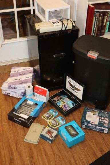 2 Drawer Metal File Cabinet (24.5"x14"x18"), adding Machine, Print Paper (3), Echo Show (in box), Shredder top, Alert System (in box), and additional items