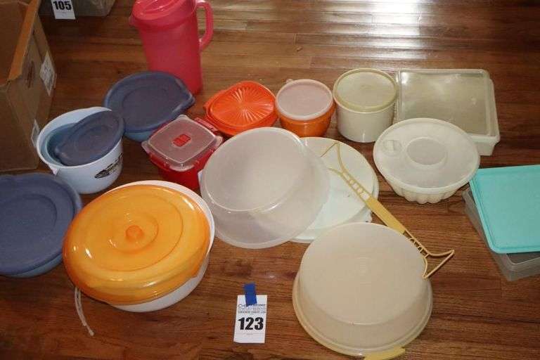Variety of Tupperware and additional plastic storage items: cake keeper, pitcher, containers, canisters bowls etc.