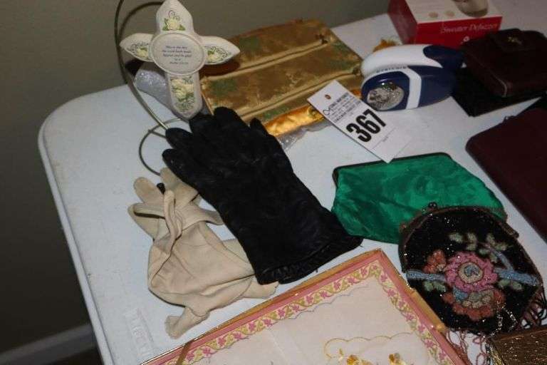 Variety of Items: Ladies Evening Bags, Gloves, Wallets, Defuzzers, Handkerchiefs, Variety of Glasses, Lipstick Holders etc.