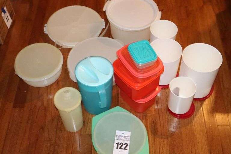 Variety of Tupperware and additional plastic storage items: cake keeper, pitcher, containers, canisters bowls etc.