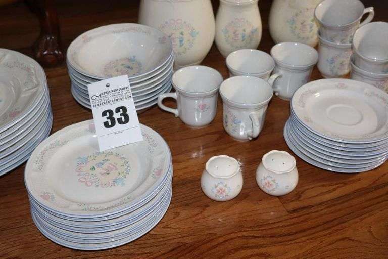 Set of "Tienshan Stoneware "Country Bouquet": 8 dinner plates, 7 dessert plates, 8 bowls, 8 cups, 8 saucers, 3 piece canister set & salt and pepper set