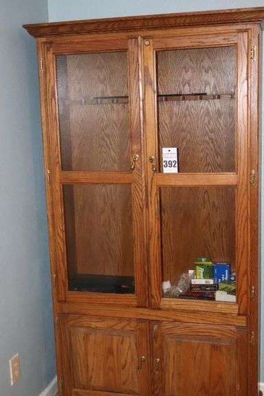 Wood Oak Gun Cabinet (76"x39"x13.5") With Glass front doors, Locking Bottom Doors - 10 guns with variety of items included (cleaning products, variety of ammunition and additional items image