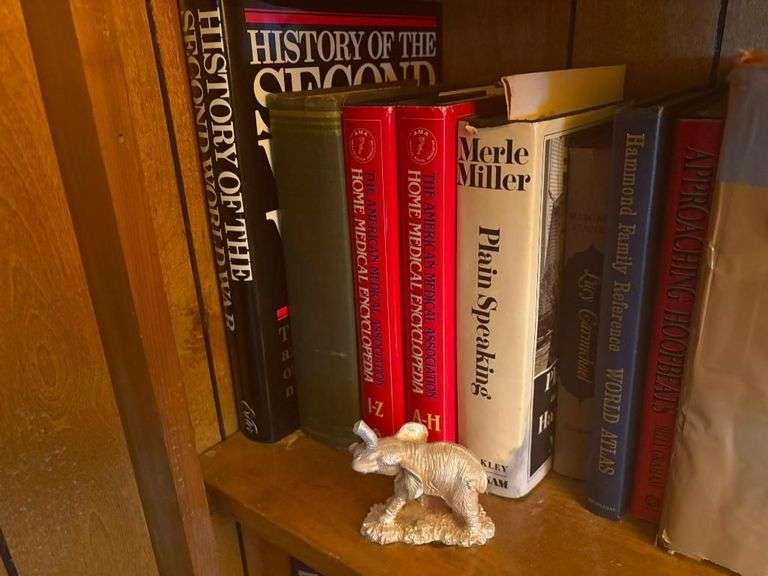 Shelf of Assorted Hardcover Books