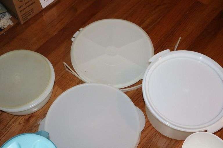 Variety of Tupperware and additional plastic storage items: cake keeper, pitcher, containers, canisters bowls etc.