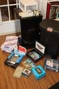 2 Drawer Metal File Cabinet (24.5"x14"x18"), adding Machine, Print Paper (3), Echo Show (in box), Shredder top, Alert System (in box), and additional items