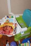 Variety of Kid Items: High Chair (needs a good cleaning), Seat, Toys, Jumpy Swing, Books, Etc.