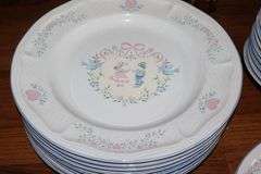 Set of "Tienshan Stoneware "Country Bouquet": 8 dinner plates, 7 dessert plates, 8 bowls, 8 cups, 8 saucers, 3 piece canister set & salt and pepper set
