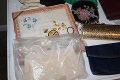 Variety of Items: Ladies Evening Bags, Gloves, Wallets, Defuzzers, Handkerchiefs, Variety of Glasses, Lipstick Holders etc.