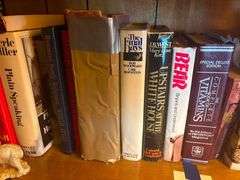 Shelf of Assorted Hardcover Books