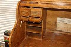 Wood Roll Top Desk (53"x53"x30") with Cubbies & drawers, drawers, slid out key board drawer, side door with drawers inside, Desk Chair (42"x27"x21") & Plastic floor protector Mat