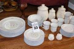 Set of "Tienshan Stoneware "Country Bouquet": 8 dinner plates, 7 dessert plates, 8 bowls, 8 cups, 8 saucers, 3 piece canister set & salt and pepper set