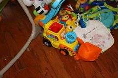 Variety of Kid Items: High Chair (needs a good cleaning), Seat, Toys, Jumpy Swing, Books, Etc.