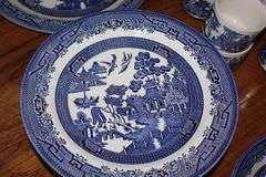 Churchill Staffordshire England "Blue Willow" design: 14 dinner plates, 5 salad bowls, 5 dessert bowls, 6 dessert plates, 14 cups, 15 saucers,2 serving bowls, platter, gravy creamer with plate