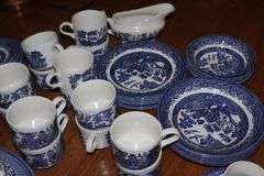 Churchill Staffordshire England "Blue Willow" design: 14 dinner plates, 5 salad bowls, 5 dessert bowls, 6 dessert plates, 14 cups, 15 saucers,2 serving bowls, platter, gravy creamer with plate