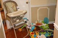 Variety of Kid Items: High Chair (needs a good cleaning), Seat, Toys, Jumpy Swing, Books, Etc.