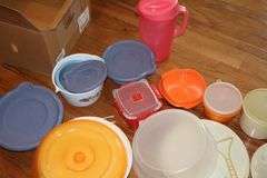 Variety of Tupperware and additional plastic storage items: cake keeper, pitcher, containers, canisters bowls etc.