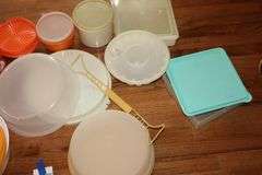 Variety of Tupperware and additional plastic storage items: cake keeper, pitcher, containers, canisters bowls etc.