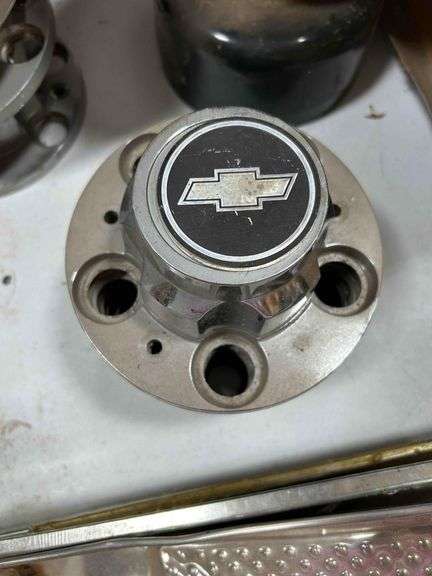 6- 4x4 Center Wheel Caps and 7 Chevy Center Wheel Caps