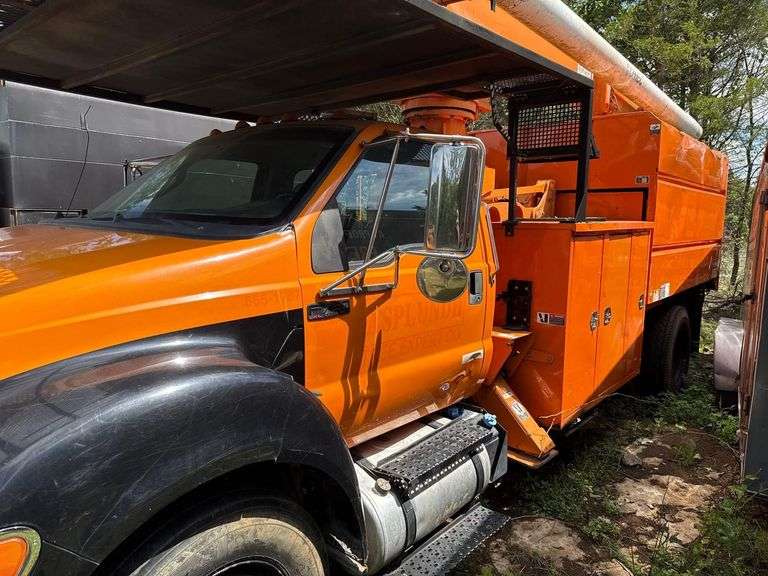 2011 Ford F750 Chip Truck equipped with an Altec boom- 75ft Elevator ( Runs but then will cut off)- Has Title