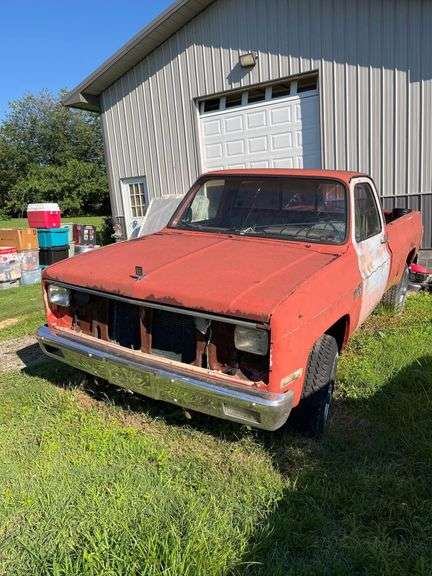 1980’s Red Chevrolet 4x4 3/4 Ton - No Motor - Some parts in Cab and Bed image