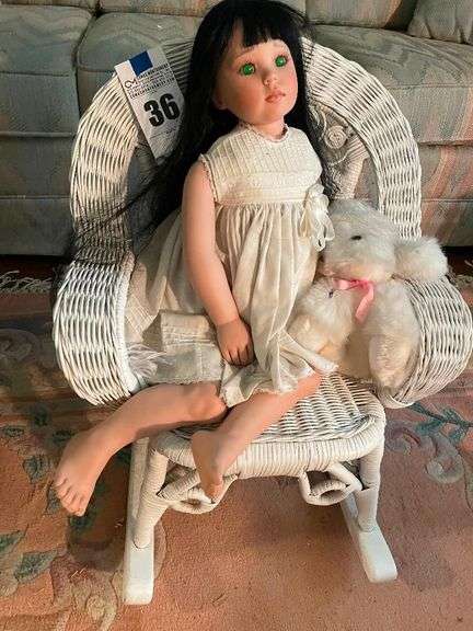 Porcelain Doll with Teddy Bear in Wicker Rocking Chair image