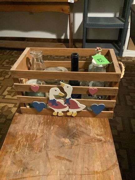 Wooden Crate with Assorted Glass Bottles and Jars image