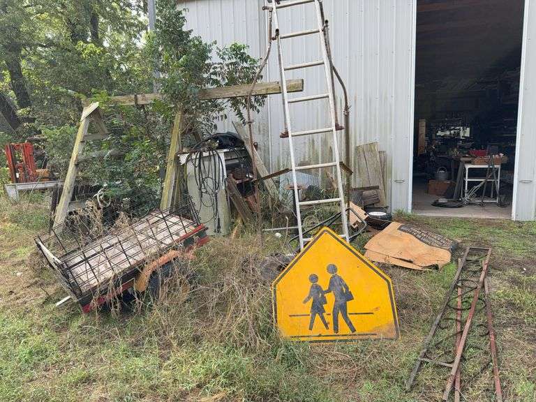 Pile of Assorted Tools and Equipment Including Ladders, Wagon, and More image