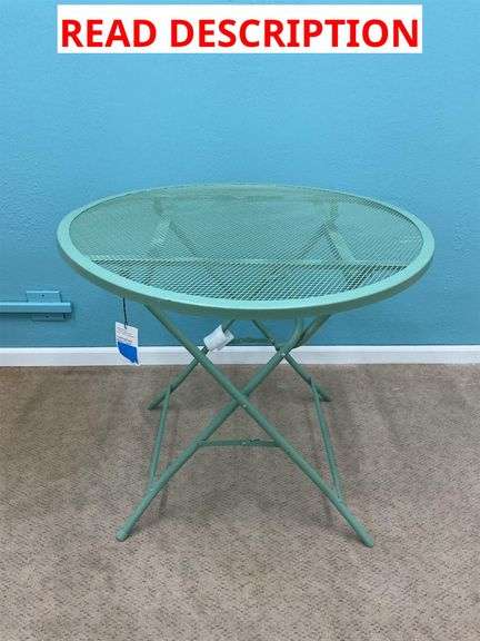 Green metal outdoor table image