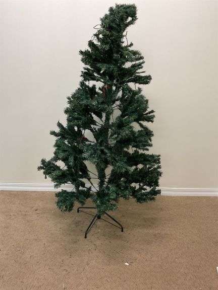 5 1/2 foot artificial green Christmas tree image