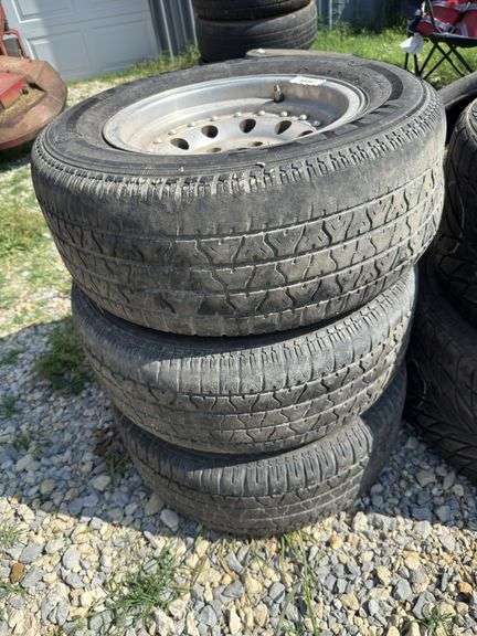Four P235/60R14 Tires on Aluminum Rims image