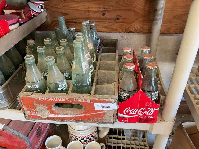 Collection of Coca-Cola Bottles with Wooden Crate image