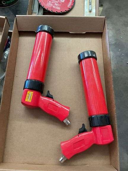 Pair of Red Pneumatic Caulking Guns image