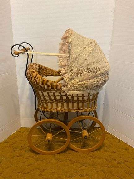 Wicker Baby Carriage with Doll image
