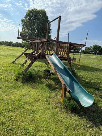 Wooden swing set w/slide, rough but has some usable parts (Buyer to remove) image