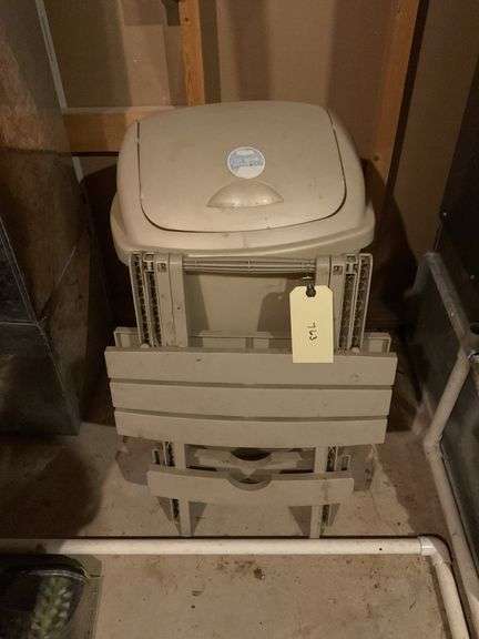 Beige Plastic Trash Can and Folding Table image