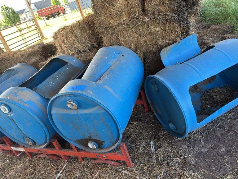 Lot of Blue Barrel Hay Feeders image