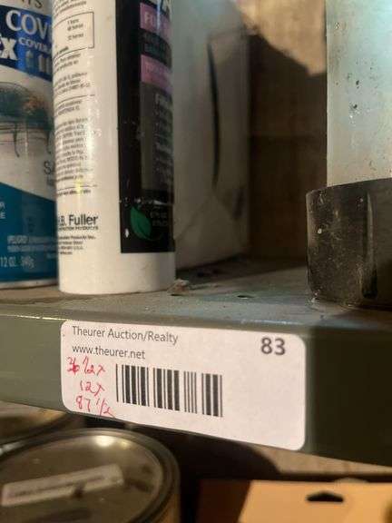 Shelving Unit With Variety of Household Supplies and Tools Included image