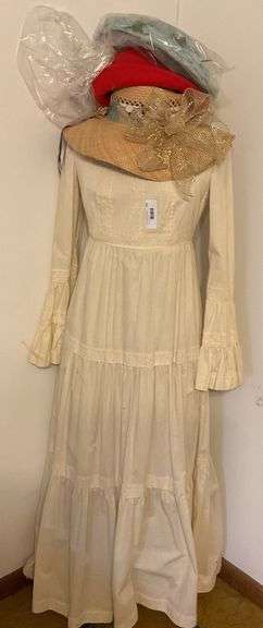 Elegant Cream Dress with Several Hats image