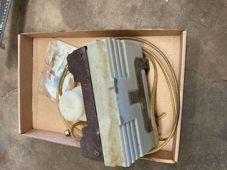 Unknown Machinery Part with Tubing and Additional Components image