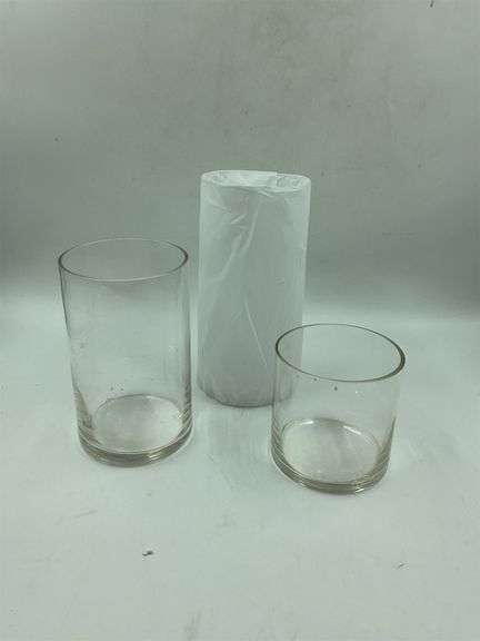 (3) round shaped glasses at different heights image