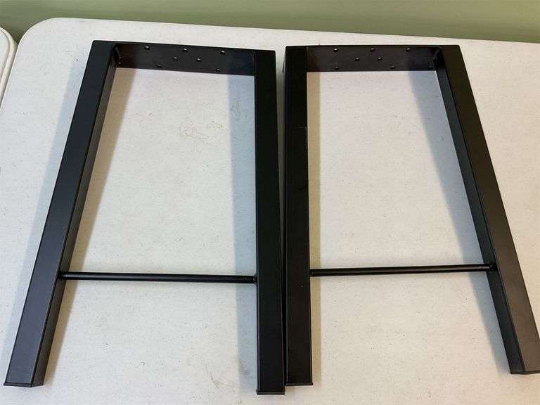 .pair of black sturdy metal legs image