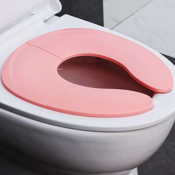 Funbliss Portable Potty Training Seat Foldable Secure Toilet Seat for Toddlers Travel Friendly Design Non Slip Suction Cups Anti Pinch Pads Fits Most Standard Toilets,Pink Toilets,Pink image