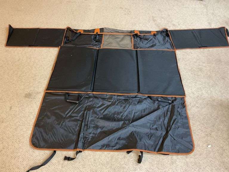 a pet car seat cover, specifically designed to protect your vehicle's interior while providing a safe and comfortable space for your pet during travel. image