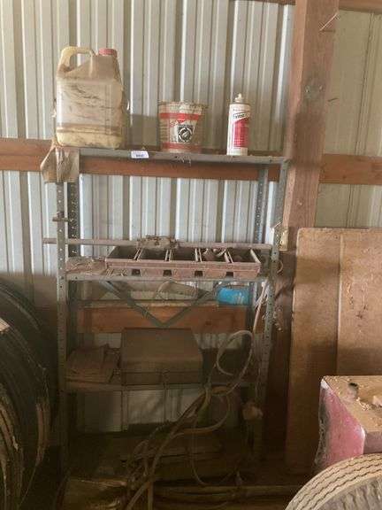 Metal Shelving Unit with Assorted Items image