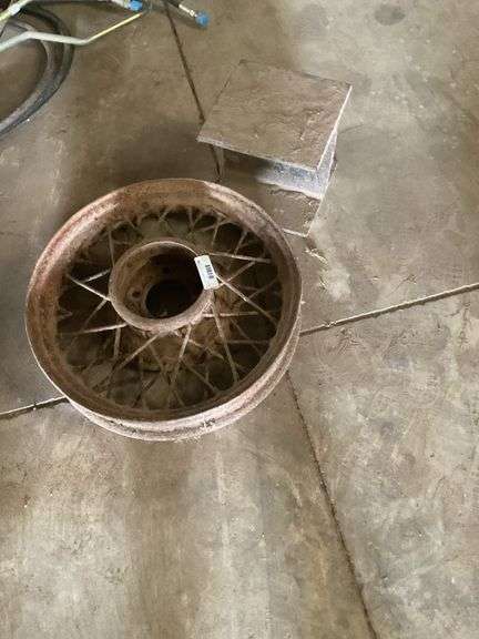 Model A Car Wire Spoke Wheel and Metal Anvil image