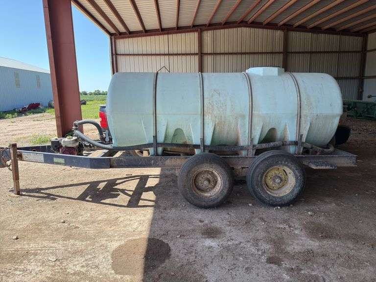 1000 gallon fiberglass tank on Schaben tandem axle trailer, Honda gas motor, pull start image