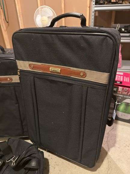 Two Rolling Lucas Suitcases with Additional Bag